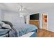 Inviting bedroom with hardwood floors, a large bed, and an en-suite bathroom at 5563 America Dr, Sarasota, FL 34231