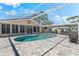 Backyard pool and patio, with outdoor living space for entertaining and relaxation at 5563 America Dr, Sarasota, FL 34231