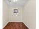 Minimalist room with hardwood floors, neutral walls, and a serene atmosphere at 5563 America Dr, Sarasota, FL 34231