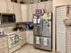 Functional kitchen with stainless steel appliances, white cabinetry, and ample counter space at 5714 Garden Lakes Dr, Bradenton, FL 34203