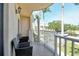 Relaxing balcony with wicker chairs offering a charming outdoor seating area at 5963 Midnight Pass Rd # 355, Sarasota, FL 34242
