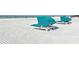 Community beach with lounge chairs at 5963 Midnight Pass Rd # 355, Sarasota, FL 34242