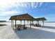 Community beach with picnic tables at 5963 Midnight Pass Rd # 355, Sarasota, FL 34242
