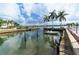 Boat lift and dock in a community waterway at 5963 Midnight Pass Rd # 355, Sarasota, FL 34242