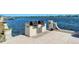 Outdoor kitchen area with built-in grill and countertop on the waterfront at 5963 Midnight Pass Rd # 355, Sarasota, FL 34242