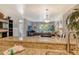 Open kitchen and living area featuring granite countertops, breakfast bar and access to outdoor balcony at 5963 Midnight Pass Rd # 355, Sarasota, FL 34242