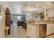 Comfortable living room with granite countertop, wood flooring, and sliding glass door to outside balcony at 5963 Midnight Pass Rd # 355, Sarasota, FL 34242