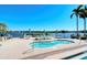 Community hot tub and pool with waterfront views and lounge chairs at 5963 Midnight Pass Rd # 355, Sarasota, FL 34242