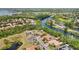 Aerial view highlights waterfront homes offering direct canal access, ideal for boating and enjoying waterfront living at 6222 Stillwater Ct, Bradenton, FL 34201