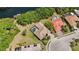 An aerial view showcases a home with an in-ground pool and well-manicured landscaping, close to the waterfront at 6222 Stillwater Ct, Bradenton, FL 34201