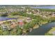 Aerial view showcases the property's spacious layout, natural surroundings, and proximity to lake, parks and residential area at 6222 Stillwater Ct, Bradenton, FL 34201