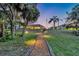 Beautiful backyard featuring a walkway and a screened-in porch perfect for outdoor entertaining at 6222 Stillwater Ct, Bradenton, FL 34201