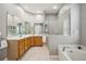 Spacious bathroom with double vanity, soaking tub, and separate glass-enclosed shower at 6222 Stillwater Ct, Bradenton, FL 34201
