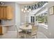 Bright breakfast nook with a view of the pool and access to the kitchen at 6222 Stillwater Ct, Bradenton, FL 34201