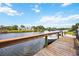 Private dock features a boat lift and offers direct access to the waterway, creating the perfect setting for boating enthusiasts at 6222 Stillwater Ct, Bradenton, FL 34201