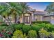 Charming home featuring a well-manicured front yard and an elegant front door at 6222 Stillwater Ct, Bradenton, FL 34201