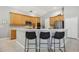 Modern kitchen featuring stainless steel appliances, breakfast bar, and ample cabinet space at 6222 Stillwater Ct, Bradenton, FL 34201