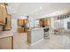 Spacious kitchen with wood cabinetry, modern appliances, and a breakfast bar at 6222 Stillwater Ct, Bradenton, FL 34201