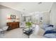 Cozy living room with tile flooring, stylish decor, and ample natural light at 6222 Stillwater Ct, Bradenton, FL 34201