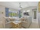 Bright living room featuring comfortable seating, stylish decor, and a view of the inviting outdoor pool area at 6222 Stillwater Ct, Bradenton, FL 34201