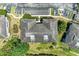 Aerial view of the building's roof, parking area, and verdant greenery creating a peaceful environment at 628 Estuary Dr, Bradenton, FL 34209