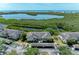 Stunning aerial view of the community, showcasing lush landscaping, water features, and nearby waterfront access at 628 Estuary Dr, Bradenton, FL 34209