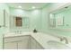 Bright bathroom with dual sinks, modern fixtures, and ample counter space at 628 Estuary Dr, Bradenton, FL 34209