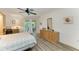 Bedroom featuring tile floors, a ceiling fan, and a balcony at 628 Estuary Dr, Bradenton, FL 34209
