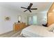 Bedroom featuring tile floors, ceiling fan, and a full bathroom at 628 Estuary Dr, Bradenton, FL 34209