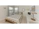 Charming bedroom with ample natural light, coastal decor, and comfortable furnishings at 628 Estuary Dr, Bradenton, FL 34209