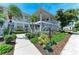 Beautiful condo building featuring mature landscaping, green lawns and a private entrance staircase at 628 Estuary Dr, Bradenton, FL 34209