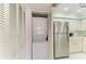 Kitchen features stainless steel fridge and appliances, white cabinetry, and laundry at 628 Estuary Dr, Bradenton, FL 34209