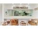Kitchen with breakfast bar, stainless steel appliances, and neutral cabinetry at 628 Estuary Dr, Bradenton, FL 34209