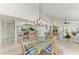 Open concept living area with seamless flow between the kitchen, dining, and seating areas at 628 Estuary Dr, Bradenton, FL 34209