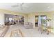 Open living space with tile floors, a sunroom, and a living room with comfortable seating at 628 Estuary Dr, Bradenton, FL 34209