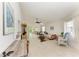 Bright living room with vaulted ceilings, neutral decor, and access to outdoor space at 628 Estuary Dr, Bradenton, FL 34209