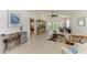 Bright living room with vaulted ceilings, neutral decor, and comfortable seating at 628 Estuary Dr, Bradenton, FL 34209