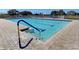 Community pool featuring clear water, brick pavers, a metal grab rail and no diving sign at 628 Estuary Dr, Bradenton, FL 34209
