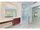 This luxurious bathroom boasts a glass shower and vanity at 6324 41St E Ct, Sarasota, FL 34243