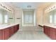 Bright bathroom featuring double vanities and a large soaking tub at 6324 41St E Ct, Sarasota, FL 34243