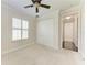 Bright bedroom with neutral carpet and large closet at 6324 41St E Ct, Sarasota, FL 34243