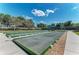 Bocce ball courts with green borders near tennis courts at 6324 41St E Ct, Sarasota, FL 34243