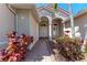 Inviting front entrance showcasing a brick pathway and beautiful landscaping at 6324 41St E Ct, Sarasota, FL 34243