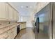 This kitchen has stylish cabinets, stainless appliances, and a spacious layout at 6324 41St E Ct, Sarasota, FL 34243