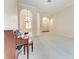 Spacious living room showcasing arched entryways, carpet floors and a chandelier at 6324 41St E Ct, Sarasota, FL 34243