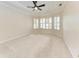 A bright main bedroom features large windows and neutral tones at 6324 41St E Ct, Sarasota, FL 34243