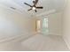 A bright main bedroom features a tray ceiling and ensuite access at 6324 41St E Ct, Sarasota, FL 34243