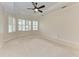 A bright main bedroom features large windows and neutral tones at 6324 41St E Ct, Sarasota, FL 34243