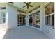 Open patio with large sliding doors providing easy access to the interior of the home and view of pool at 6324 41St E Ct, Sarasota, FL 34243