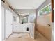 Bathroom with double vanity, walk-in shower and neutral tile at 7710 Seven Oaks Dr, Bradenton, FL 34201